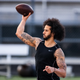 Colin Kaepernick looks to pass during his NFL workout held at Charles R Drew high school on November 16, 2019 in Riverdale, Georgia.